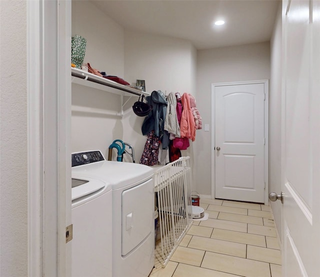washroom featuring laundry area, washer and clothes dryer, light tile patterned floors, and recessed lighting