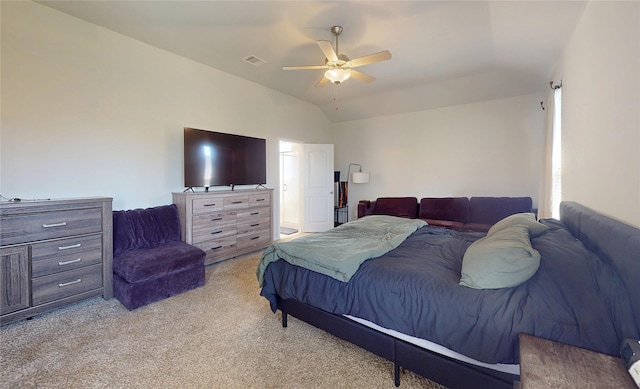 bedroom featuring visible vents, a ceiling fan, vaulted ceiling, and light carpet