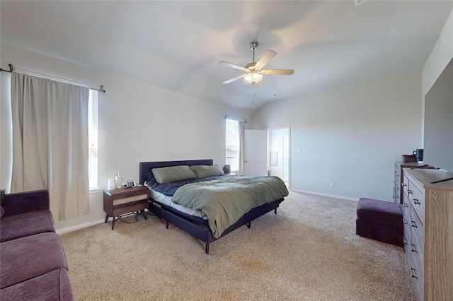 bedroom featuring baseboards, light carpet, and lofted ceiling
