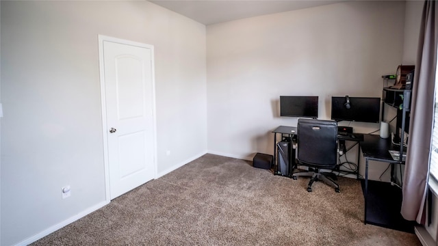 carpeted office space with baseboards