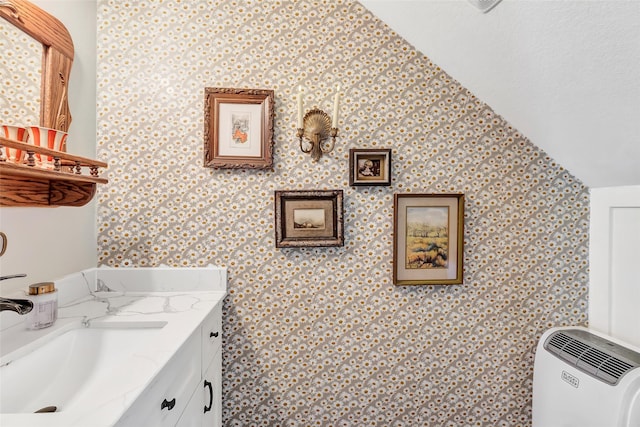 719 Tarpaulin Way, Crosby, TX 77532 - bathroom with vanity and vaulted ceiling