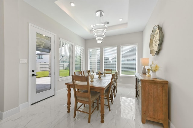 dining area with visible vents, baseboards, a tray ceiling, recessed lighting, and marble finish floor