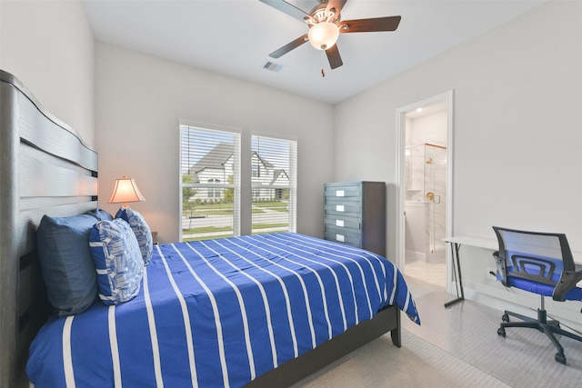 bedroom with visible vents, ensuite bath, and a ceiling fan