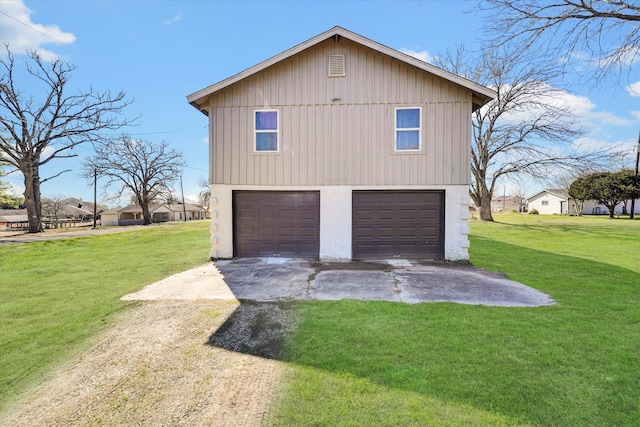 garage with concrete driveway