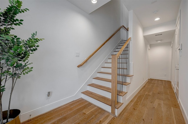 2414 Canal St Unit A, Houston, TX 77003 - stairs featuring wood finished floors, baseboards, and recessed lighting
