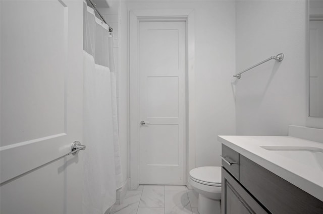 2414 Canal St Unit A, Houston, TX 77003 - bathroom featuring marble finish floors, toilet, vanity, and a shower with shower curtain