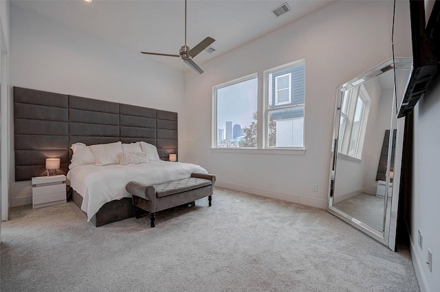 2414 Canal St Unit A, Houston, TX 77003 - bedroom featuring multiple windows, carpet flooring, baseboards, and a ceiling fan