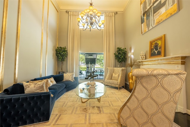 living room with an inviting chandelier, a high ceiling, and crown molding