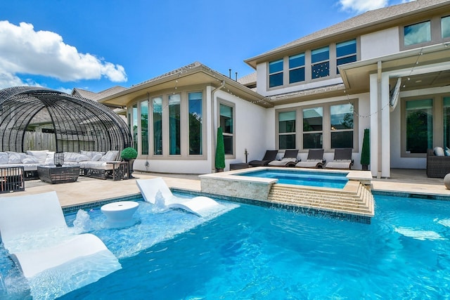 rear view of house featuring stucco siding, a patio, an outdoor pool, an outdoor hangout area, and an in ground hot tub