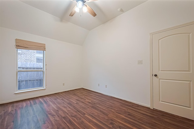 6010 Le Moyne Pass Ln, Missouri City, TX 77459 - spare room with dark wood-type flooring, a ceiling fan, and vaulted ceiling
