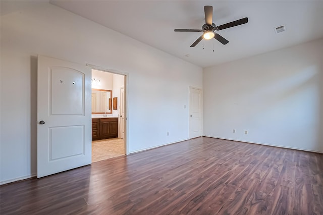6010 Le Moyne Pass Ln, Missouri City, TX 77459 - unfurnished bedroom with visible vents, a ceiling fan, a sink, wood finished floors, and connected bathroom