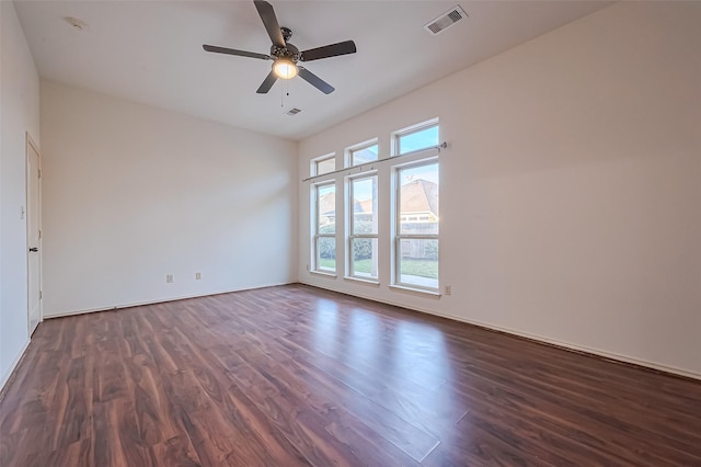 6010 Le Moyne Pass Ln, Missouri City, TX 77459 - unfurnished room with dark wood finished floors, visible vents, baseboards, and a ceiling fan