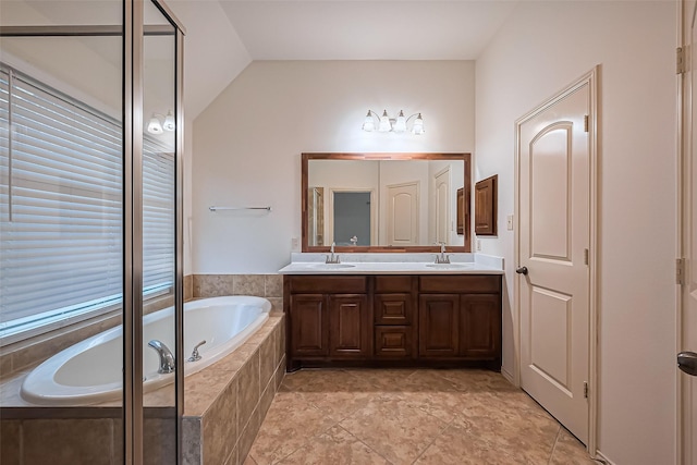 6010 Le Moyne Pass Ln, Missouri City, TX 77459 - full bath featuring lofted ceiling, a garden tub, double vanity, and a sink