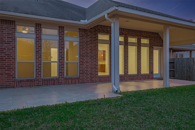 6010 Le Moyne Pass Ln, Missouri City, TX 77459 - back of house featuring a patio, a yard, brick siding, and roof with shingles
