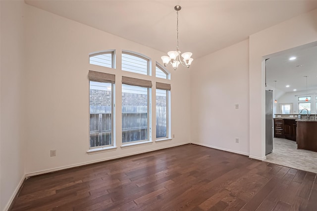 6010 Le Moyne Pass Ln, Missouri City, TX 77459 - unfurnished dining area with baseboards, a chandelier, recessed lighting, dark wood-style floors, and a sink