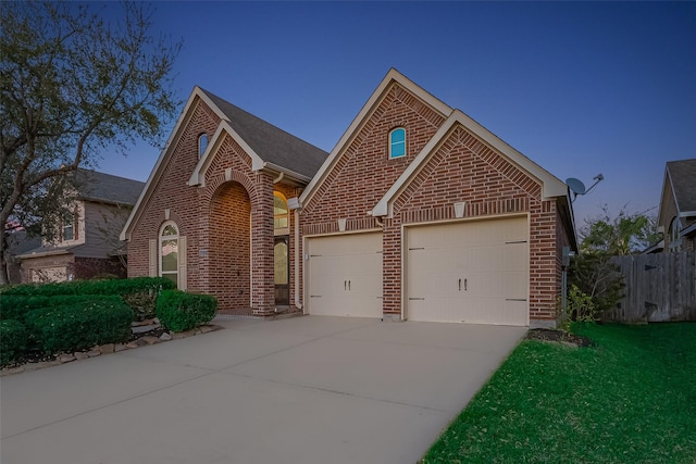 6010 Le Moyne Pass Ln, Missouri City, TX 77459 - view of front of property featuring concrete driveway, an attached garage, fence, and brick siding