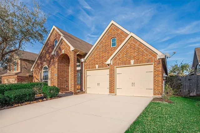 6010 Le Moyne Pass Ln, Missouri City, TX 77459 - traditional-style home with concrete driveway, an attached garage, fence, and brick siding