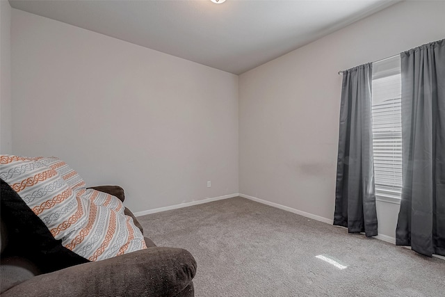 sitting room with carpet flooring and baseboards
