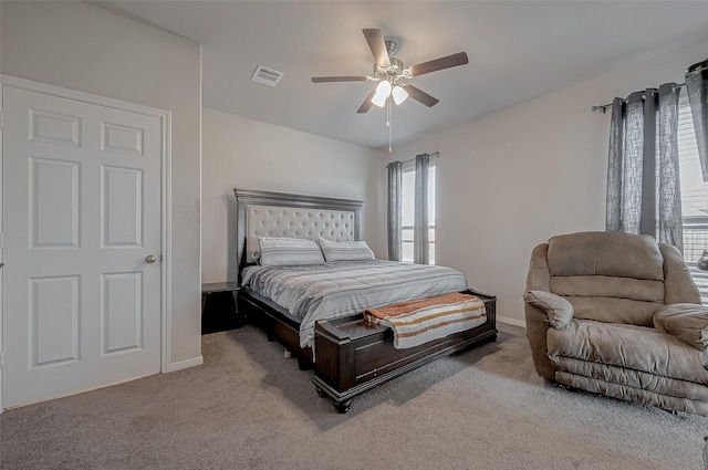 bedroom with visible vents, baseboards, carpet, and ceiling fan