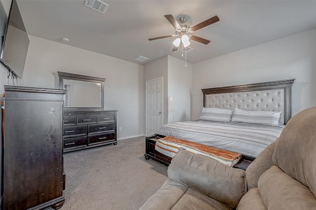 carpeted bedroom featuring visible vents, baseboards, and a ceiling fan