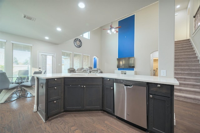 kitchen featuring dishwasher, light countertops, visible vents, and open floor plan