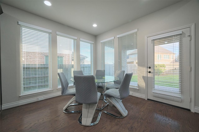 dining space with recessed lighting, wood finished floors, and baseboards