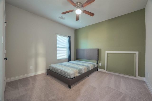bedroom with visible vents, ceiling fan, baseboards, and carpet