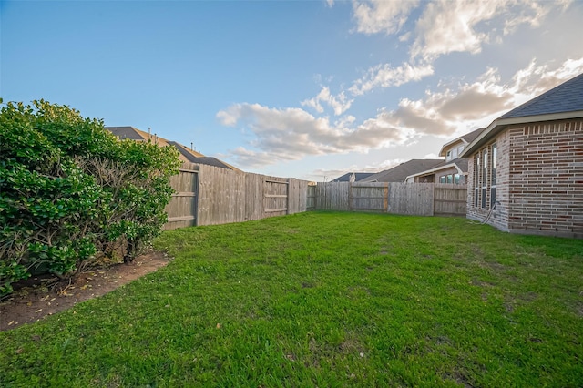 view of yard featuring a fenced backyard