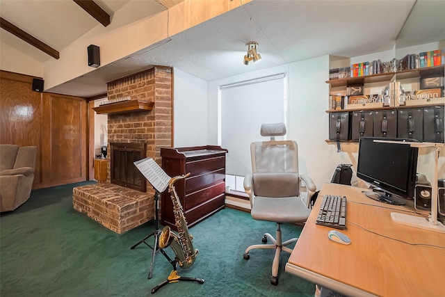 office area featuring lofted ceiling with beams, carpet, and a fireplace