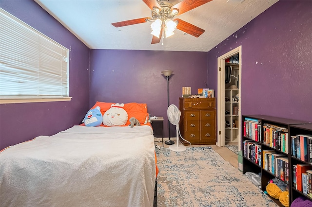 carpeted bedroom featuring a ceiling fan