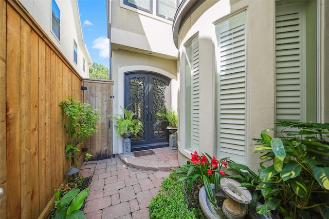 2112 Mcduffie St, Houston, TX 77019 - doorway to property featuring stucco siding and french doors