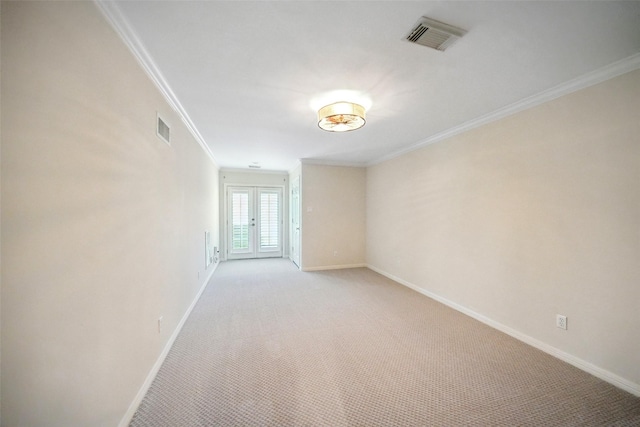 2112 Mcduffie St, Houston, TX 77019 - empty room featuring ornamental molding, light colored carpet, baseboards, and french doors