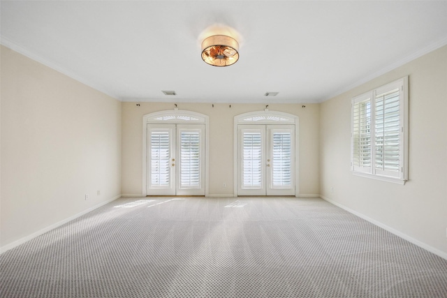 2112 Mcduffie St, Houston, TX 77019 - spare room with french doors, plenty of natural light, crown molding, light colored carpet, and baseboards