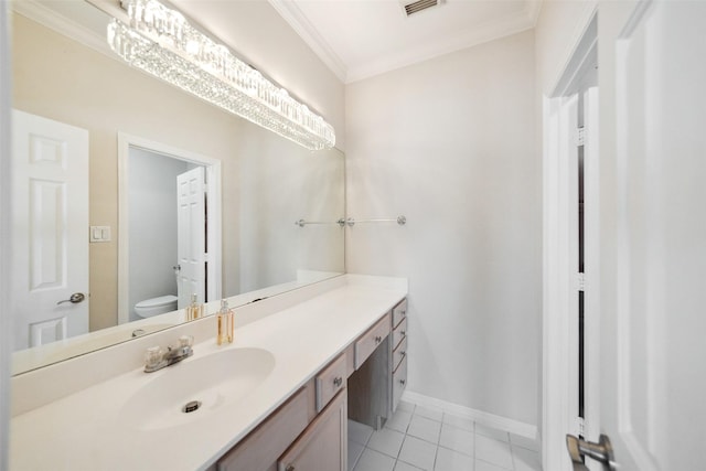 2112 Mcduffie St, Houston, TX 77019 - bathroom featuring toilet, vanity, tile patterned flooring, ornamental molding, and baseboards