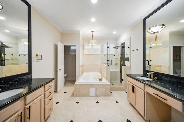 2112 Mcduffie St, Houston, TX 77019 - full bathroom featuring toilet, crown molding, a shower stall, two vanities, and a garden tub