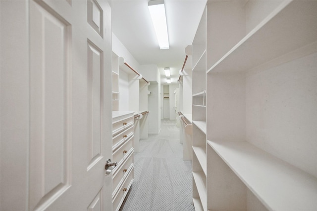 2112 Mcduffie St, Houston, TX 77019 - spacious closet featuring light carpet and light tile patterned flooring