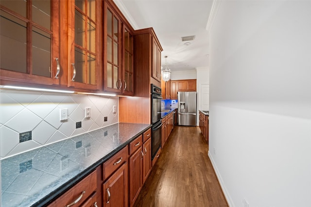 2112 Mcduffie St, Houston, TX 77019 - kitchen with stainless steel fridge with ice dispenser, dark wood-type flooring, ornamental molding, brown cabinetry, and decorative backsplash