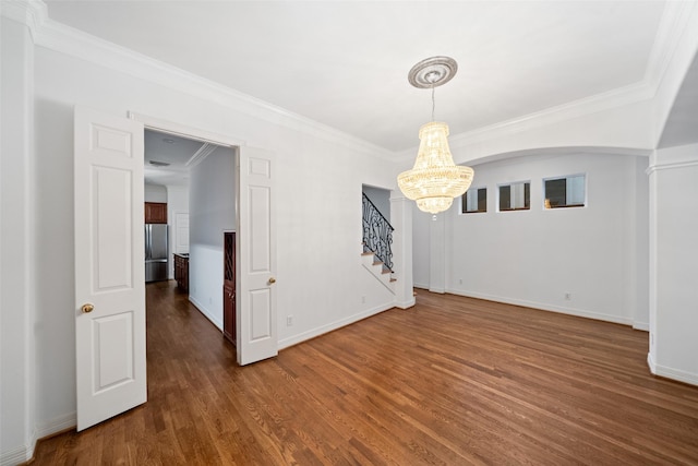 2112 Mcduffie St, Houston, TX 77019 - unfurnished room with a chandelier, dark wood finished floors, stairway, and crown molding