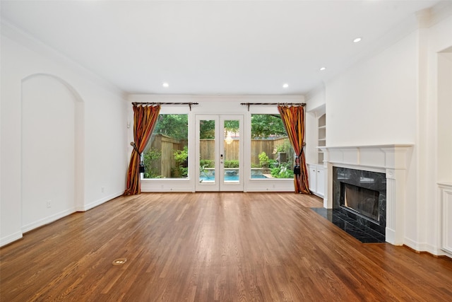 2112 Mcduffie St, Houston, TX 77019 - unfurnished living room with ornamental molding, wood finished floors, a fireplace, french doors, and recessed lighting