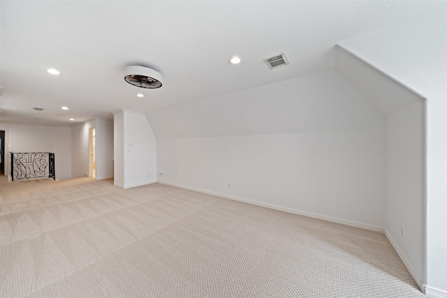2112 Mcduffie St, Houston, TX 77019 - additional living space with light colored carpet, recessed lighting, and vaulted ceiling