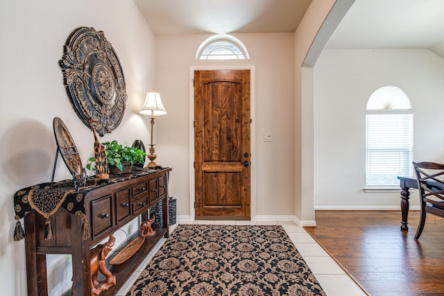 1415 Nacogdoches Valley Dr, League City, TX 77573 - foyer with arched walkways, baseboards, and wood finished floors