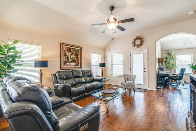 1415 Nacogdoches Valley Dr, League City, TX 77573 - living area featuring baseboards, dark wood finished floors, vaulted ceiling, arched walkways, and a ceiling fan
