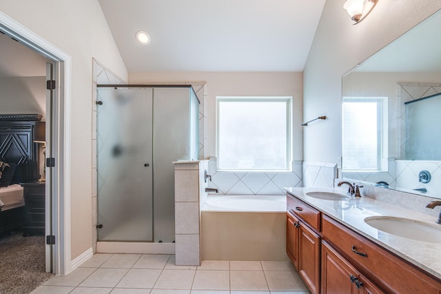 1415 Nacogdoches Valley Dr, League City, TX 77573 - bathroom featuring tile patterned flooring, vaulted ceiling, a stall shower, and a sink