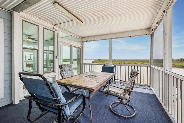 395 Redfish Dr, Freeport, TX 77541 - sunroom / solarium featuring plenty of natural light, outdoor dining space, and ceiling fan