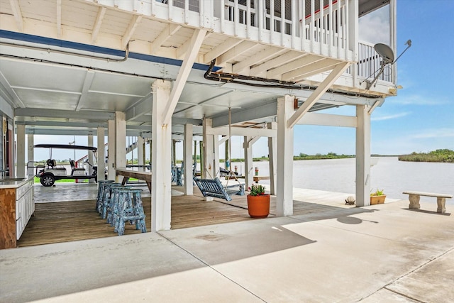 395 Redfish Dr, Freeport, TX 77541 - view of patio featuring a water view and a sink