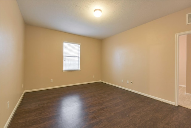 18015 Secret Branch Ln, Cypress, TX 77433 - unfurnished room featuring dark wood-style floors and baseboards