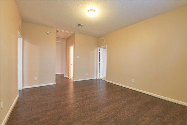 18015 Secret Branch Ln, Cypress, TX 77433 - spare room with attic access, dark wood-style floors, and baseboards