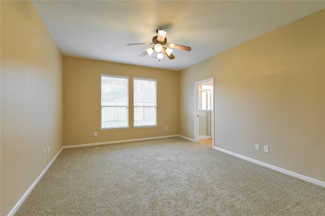 18015 Secret Branch Ln, Cypress, TX 77433 - empty room featuring ceiling fan, light colored carpet, and baseboards