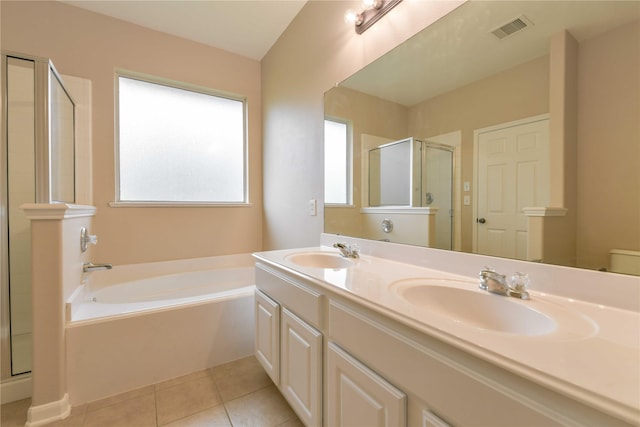18015 Secret Branch Ln, Cypress, TX 77433 - bathroom with a shower stall, a bath, double vanity, tile patterned flooring, and toilet