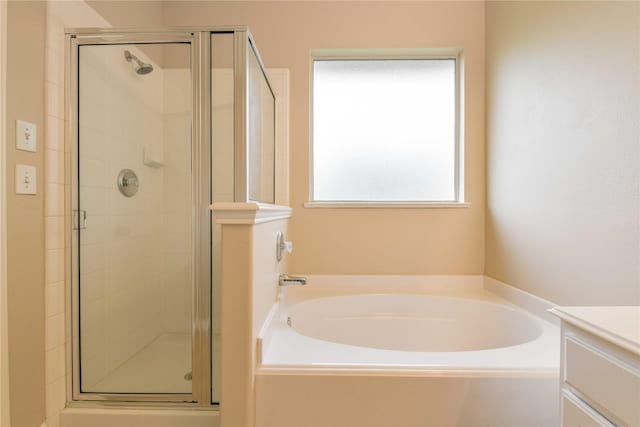18015 Secret Branch Ln, Cypress, TX 77433 - bathroom featuring a garden tub, a shower stall, and vanity